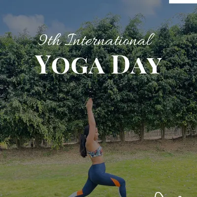 Celebrating International Yoga Day with a powerful Virabhadrasana (Warrior Pose) in a lush green park. Practicing outdoors connects us to the earth's energy.
