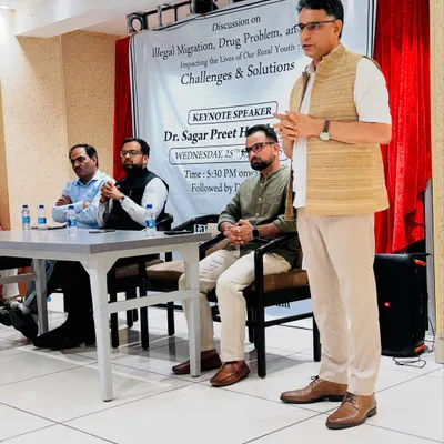 Participating in a discussion on illegal migration and drug problems affecting rural youth, alongside a Special Commissioner of Delhi Police.
