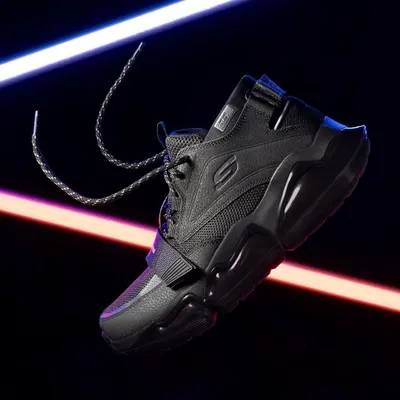 A dynamic, floating shot of Skechers shoes with creative light trails. This energetic style is perfect for performance footwear and captures a sense of movement and technology.