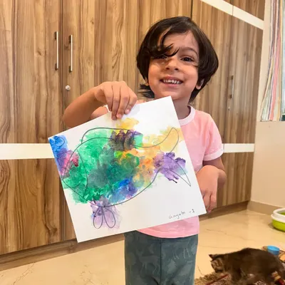 A happy smile from one of our junior one-on-one classes! This young artist is showing off his colorful blow-painted fish. Private sessions are a great way to give your child focused attention to grow their skills.