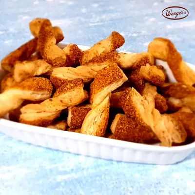 The cheesier, the better. Our cheese straws are made with flaky puff pastry and real cheese, twisted and baked until golden and crispy. They are the perfect savoury snack.