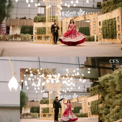 A playful and grand reception shot, with the bride twirling her red lehenga. This image captures the joy and energy of the celebration against a beautifully lit backdrop.
