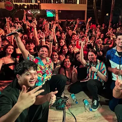 The view from our side of the stage. A massive, energetic crowd in Pune singing along with us. This is the social proof that we know how to throw a party.