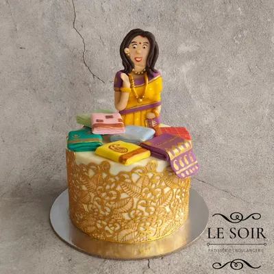 This saree-themed cake is one of my signature designs and never goes out of style. This half-kg Red Velvet cake features a beautiful figurine surrounded by a stash of tiny, hand-painted fondant sarees.