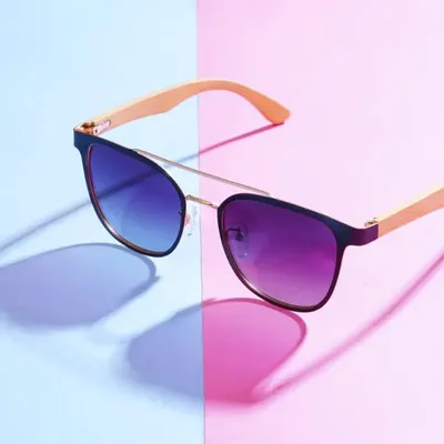 This shot for a sunglasses brand uses a dual-tone background and colored gels on the lights to create these vibrant, contrasting shadows. It's a great example of how creative lighting can make a product pop for an ad campaign.