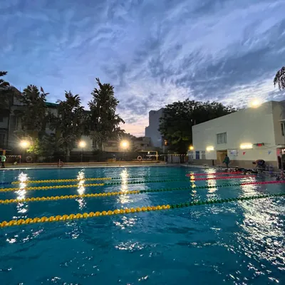 The pool at dusk, a serene yet powerful setting where our athletes conclude their day of hard work. Our facility is maintained to professional standards, providing an optimal training ground for champions.