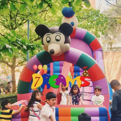 Here is the Mickey Mouse themed bouncy castle available for hire. It's a great addition to any kids' party, especially for outdoor or spacious indoor venues.