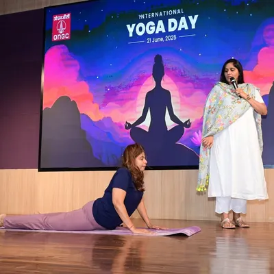 Demonstrating a simple asana for back relief during a corporate wellness session for ONGC employees. These practices are designed to be done anywhere, providing immediate relief from the strain of long hours at a desk.