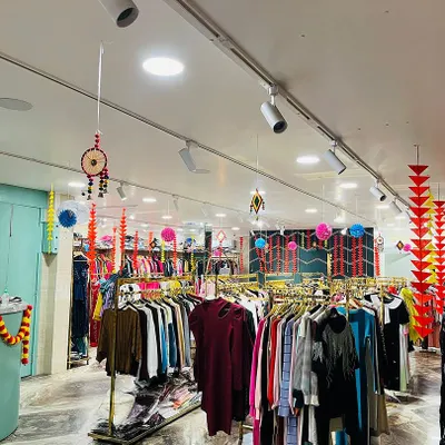 We decorated this retail store for Diwali with traditional hangings and colorful papercrafts. The decor includes marigold garlands, paper pompoms, and dreamcatchers to create a festive shopping atmosphere.