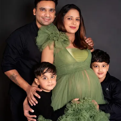From a family of four to a family of five. The two big brothers are so excited to meet their new sibling. It's a joy to capture the anticipation of the entire family during a maternity session.