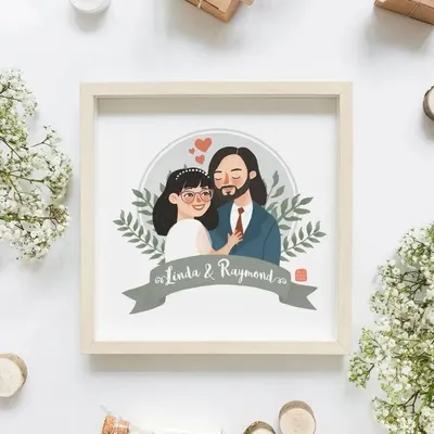 A personalized couple illustration, framed and ready to be gifted. We create these custom portraits for anniversaries, weddings, or just to celebrate love, complete with names and banners.