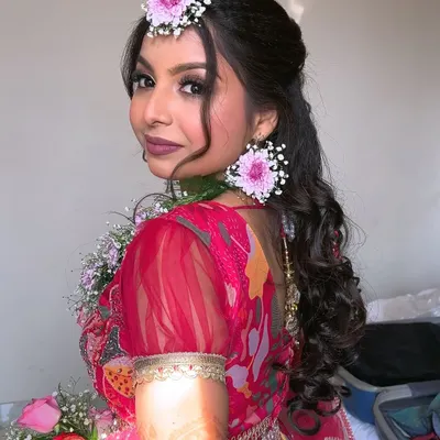 My bride Swati, looking fresh and beautiful for her "Phoolon ki Haldi" or flower shower event. We kept the makeup very natural and created a fun, glamorous hairstyle to match the happy vibe.