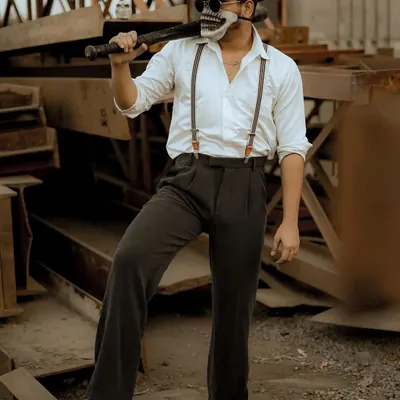 A highly conceptual and edgy photoshoot with a skull mask and baseball bat. This type of creative work is great for making a bold statement in a portfolio or for an artistic project.