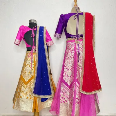 A sister is a first best friend. We designed these handcrafted Banarasi lehengas for two sisters, using vibrant colors and traditional weaves to celebrate their special bond.