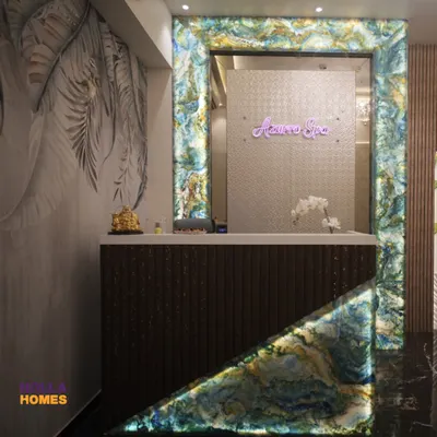 The entrance to Azurro Spa features a striking reception desk framed with backlit agate stone. This design choice immediately establishes a sense of luxury and tranquility, setting the tone for the entire wellness experience.