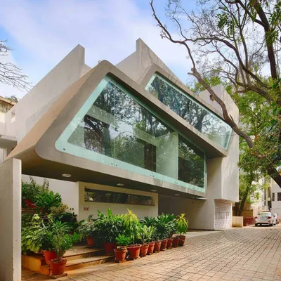The Mobius Home in Bangalore, where the building's form was shaped by the existing trees. This project exemplifies our commitment to integrating architecture with nature, rather than displacing it.