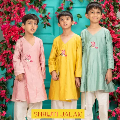 Three brothers, three times the charm. This image showcases my Angrakha-style kurtas in beautiful pastel shades of pink, yellow, and green. The delicate bird embroidery adds a unique touch to this traditional silhouette.