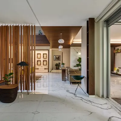 In the Kanasu residence, large sliding glass doors completely retract, merging the living room with the outdoor deck and vertical garden. This creates a single, expansive space for relaxation and entertainment.