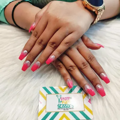 This look combines two effects: a vibrant pink to silver glitter gradient. The ombre effect on these long coffin nails is super glamorous and perfect for making a statement.