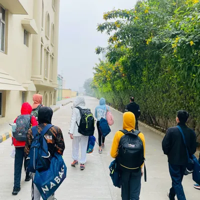 The path to the pool on a cold winter morning. Our swimmers show dedication year round, understanding that consistency is the key to success. We train smart to build champions, no matter the season.