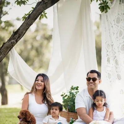 This beautiful outdoor family portrait is complete with their two wonderful dogs. I always make space for your pets, because a family photo isn't complete without everyone.