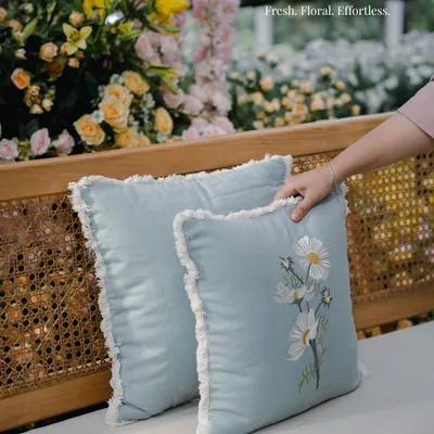 Fresh, floral, and effortless. These light blue cushions with delicate embroidered daisies were chosen for the Mussoorie Haldi to add a soft, fresh touch to the rattan seating.