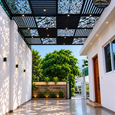 We transformed this driveway into an elegant gallery with a custom-designed carport roof. The design alternates between solid louvers and intricate floral-patterned CNC panels, with integrated spotlights that create a beautiful play of light and shadow in the evening.