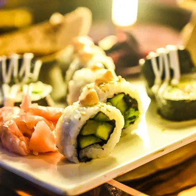 A close-up of our expertly prepared Japanese sushi, served with pickled ginger and wasabi. Our Pan-Asian selection brings delicate and authentic flavors to your event menu.