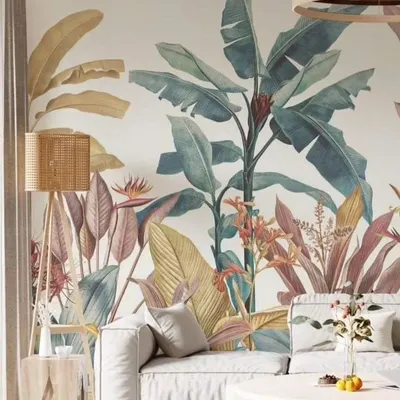 This living room features a soft, pastel-toned tropical wallpaper that creates a calm and airy feel. The design is detailed yet gentle, perfectly complementing the minimalist furniture and modern decor for a sophisticated nature-inspired look.