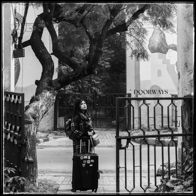 The cover shot for my 'Doorways' series. For me, this image of a woman with her luggage represents the start of a journey, a search for warmth and home in a new city.