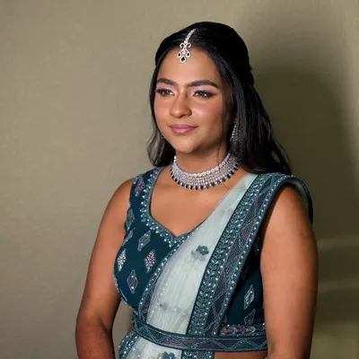 A soft glam look perfect for a reception or sangeet. I paired a shimmering eye with a rosy lip and a flawless, dewy base to complement her beautiful teal and silver lehenga.