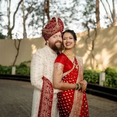 A portrait of pure happiness. We captured this beautiful smile during a relaxed moment, showcasing the couple's easy chemistry and the joy of their cross-cultural union.