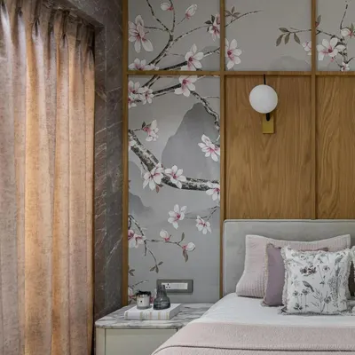 In this project with Suvarna Designhouse, we used a custom Chinoiserie wallpaper to add artistic sophistication. The delicate cherry blossoms, set against a serene mountain landscape and framed by wood paneling, create a focal point of timeless charm.