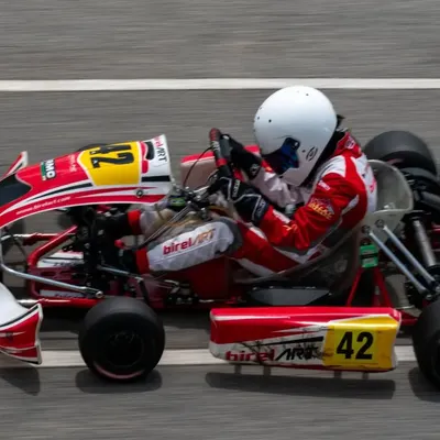 An overhead view of our BirelART kart at speed, demonstrating a clean line through the corner. This high-performance chassis is the foundation of our arrive and drive karting program.