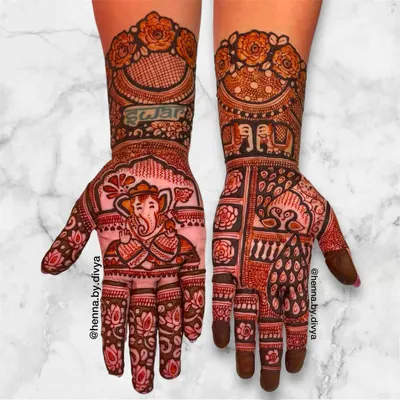 A divine design for Ganesh Chaturthi, featuring a beautifully detailed portrait of Lord Ganesha on the palm. The phrase "Shree Ganeshay Namah" is written above, surrounded by lotus and floral patterns.