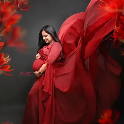 I love a dramatic fabric toss! This gorgeous mama in a deep red gown looks absolutely magical. This technique adds so much movement and life to a maternity portrait.