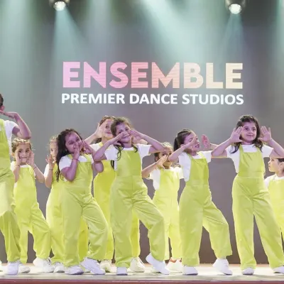 A group of our young dancers strikes a pose during their performance at the 'WSS-25' showcase. Their synchronized movements and expressive faces capture the fun of performing together.
