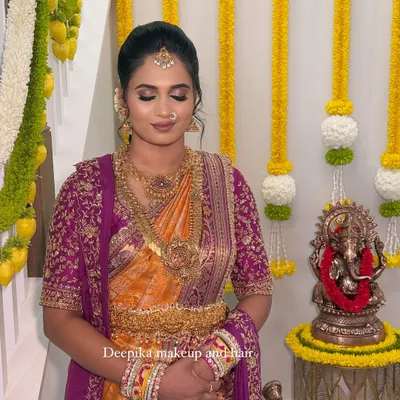 A beautiful, soft glam look for a client's housewarming ceremony in the USA, complete with a traditional saree and jewelry.