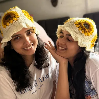 My sister and I modeling our handmade crochet sunflower bucket hats. They are stylish, comfortable, and perfect for adding a fun touch to any outfit.