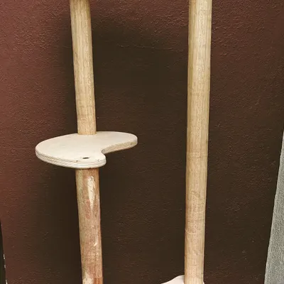 An in-progress custom cat tree with uniquely shaped platforms. This piece was designed to give a cat multiple levels for perching and playing in a compact space.