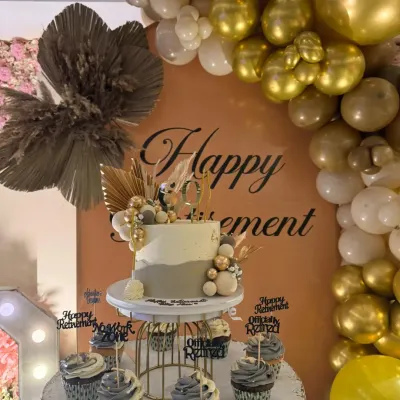 The details make the celebration. For this 60th retirement party, I arranged a beautiful themed cake and cupcakes that perfectly matched the elegant gold and grey decor.