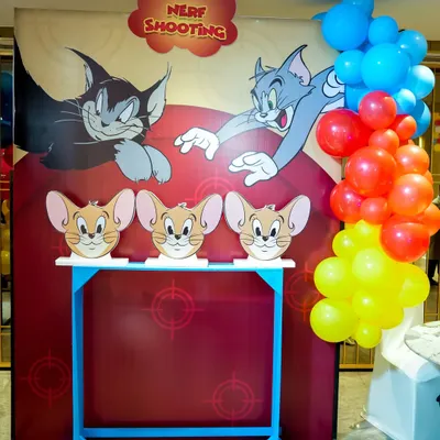 A custom-made Nerf shooting gallery for a Tom & Jerry party, where guests can aim for Jerry-themed targets.