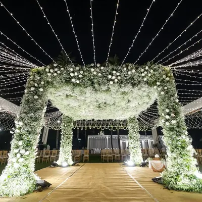 A closer look at the magnificent mandap made of baby's breath. The sheer volume of flowers creates a soft, cloud-like effect that is both romantic and luxurious.