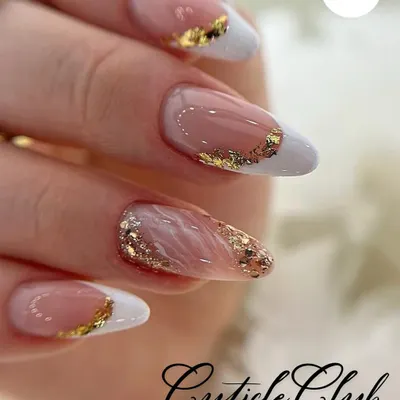 A perfect example of a modern French manicure. I used a classic white tip on an almond-shaped nail and elevated it with a touch of gold foil for a chic and luxurious finish.