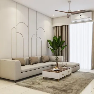 A comfortable and stylish living room with a large L-shaped sofa. The back wall features elegant arched paneling, creating a subtle yet sophisticated backdrop for the entire space.