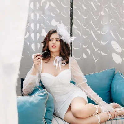 A full-look shot from a retro-themed fashion shoot. The makeup, featuring defined eyes and a soft lip, was paired with a vintage-inspired hairstyle and accessories to create a cohesive and glamorous aesthetic.