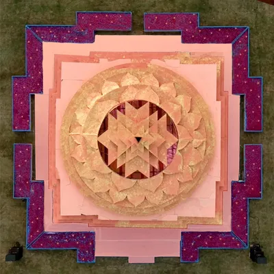 An aerial view of our Shri Yantra mandap, showcasing the intricate geometric patterns that form the foundation of this sacred design, symbolizing cosmic harmony and prosperity.