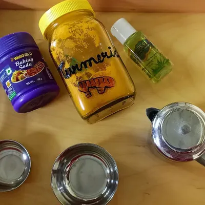 The simple household ingredients for our "invisible ink" experiment: turmeric, baking soda, and lemon juice. I show the children how everyday items can create scientific magic.