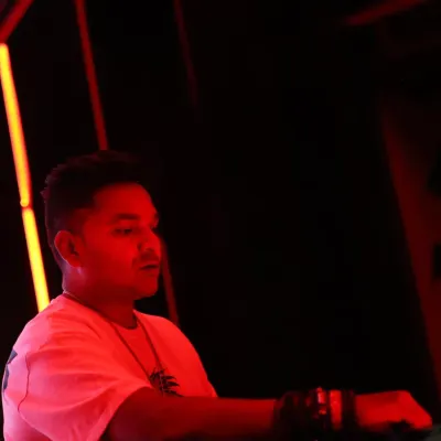 Lost in the music under the red lights of the club. Every set is about finding that perfect groove and taking the crowd with me on a sonic journey.