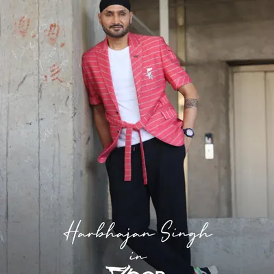 The true Indian blood. Cricketer Harbhajan Singh in a distinctively crafted custom pink striped blazer set. Dapper and defined, this look is a perfect example of our modern tailoring.